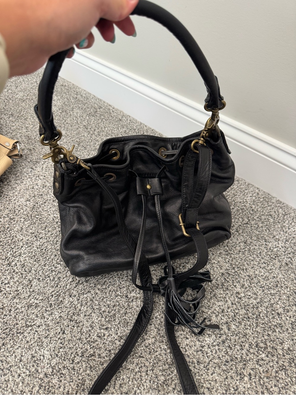 Classic Black Leather Drawstring Shoulder Bag with Brass Hardware